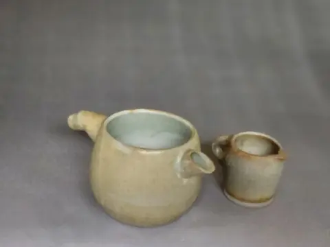 Pale green pitcher pair