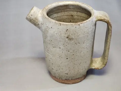 Speckled white pitcher (1 of 2)